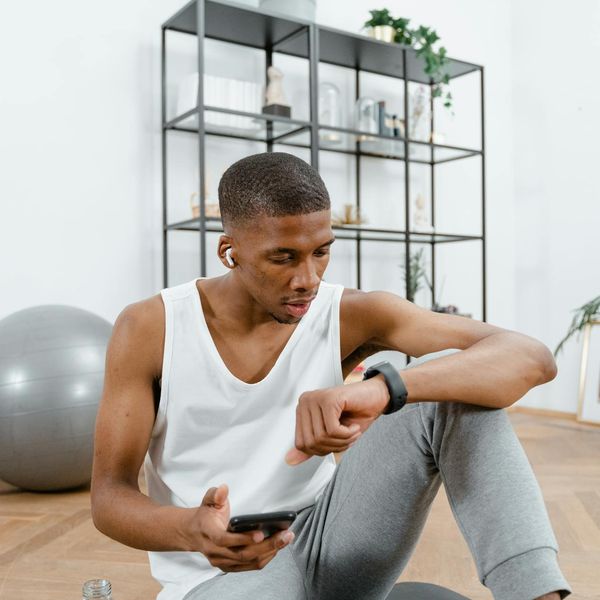 A man looking confident and relaxed after a workout session.
